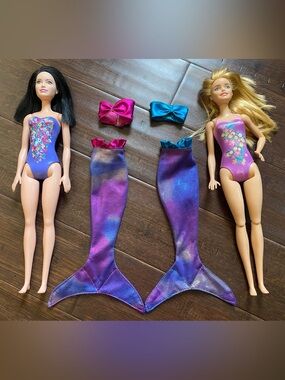 2 Swim Barbies with 2 mermaid outfits